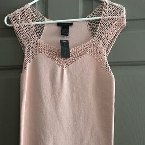 The limited blush pink sleeveless shirt